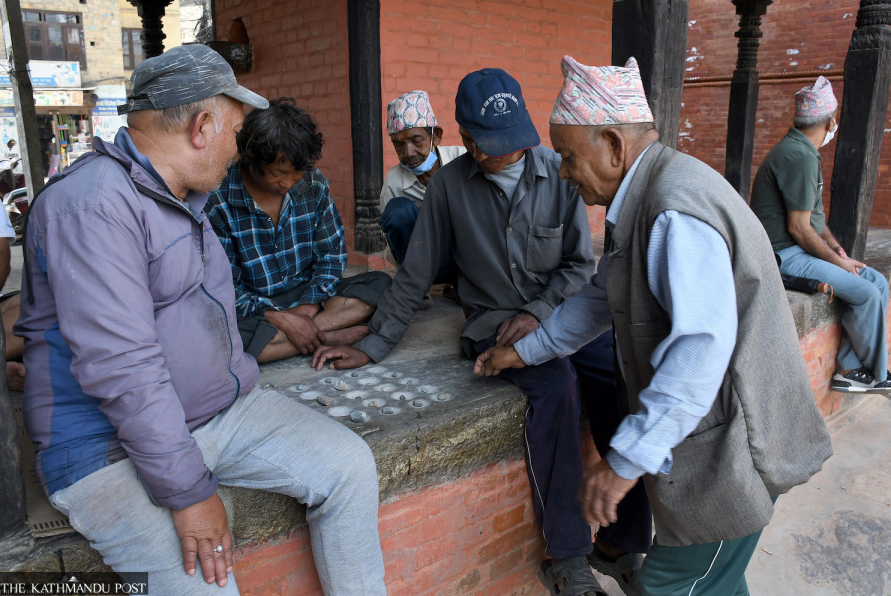 Elderly players enjoing Baghchal Patan Durbar Square